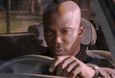 Doakes sus meme sitting in car staring at you with suspicious unblinking look