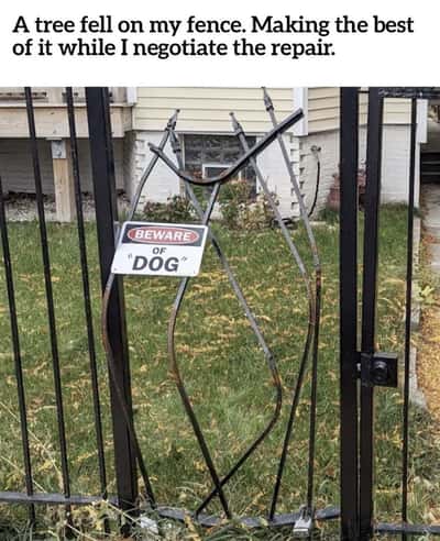 Twisted bent metal fence beware of dog meme that forms a spiky wiggly dog