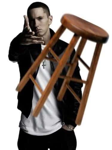 Eminem throwing meme launching a wooden bar stool