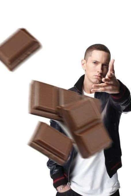 Eminem throwing meme launching flying chocolate bars