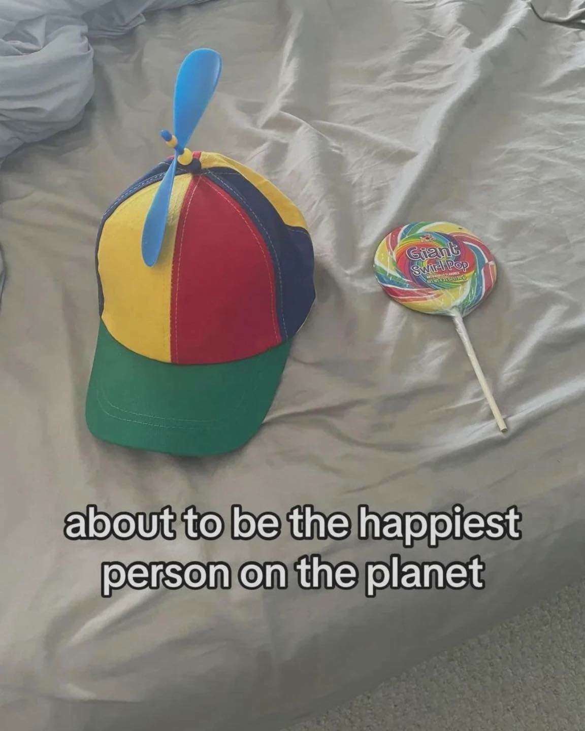 Colorful Hat & Giant Swirl Pop Meme: Happiest Person on Planet