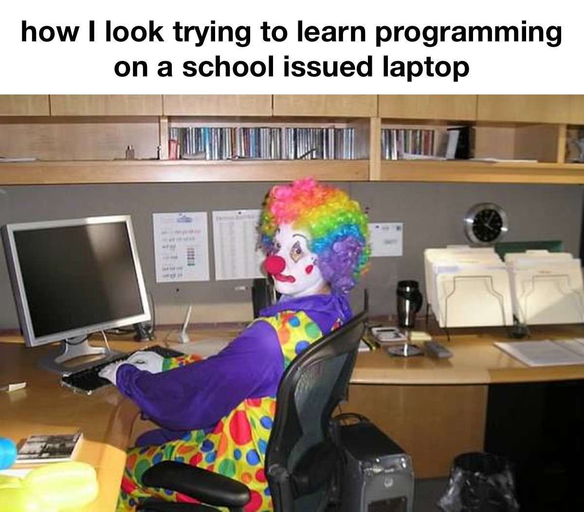 Clown Computer: how I look trying to learn programming on a school issued laptop