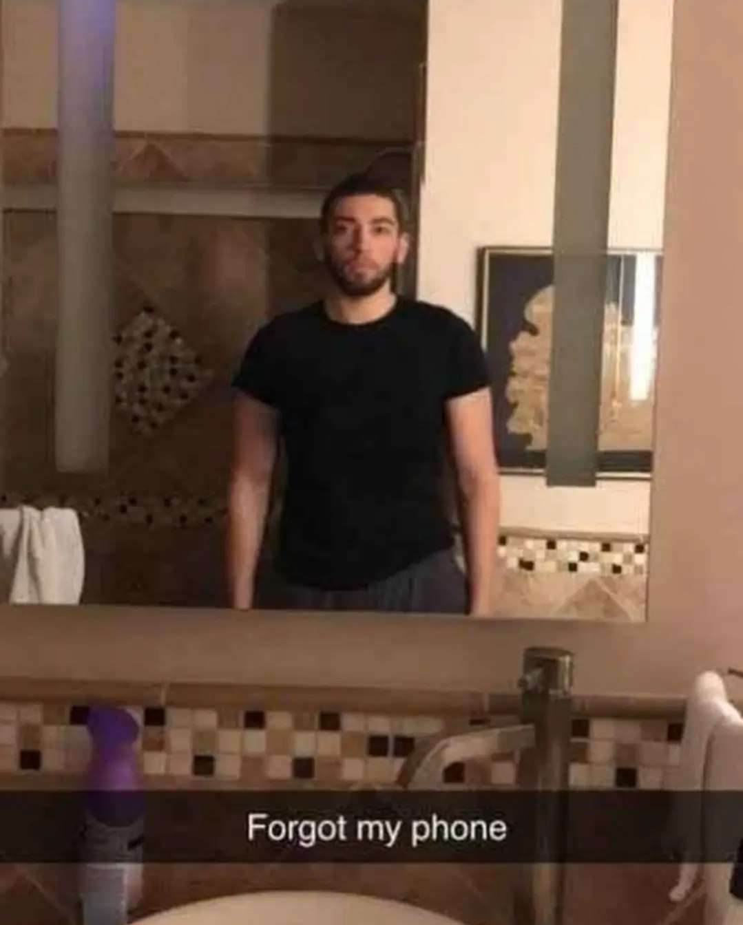 Man meme standing in bathroom after forgetting his phone