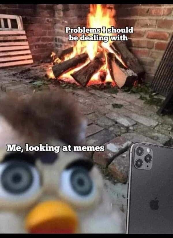 Furby meme about ignoring problems by scrolling memes