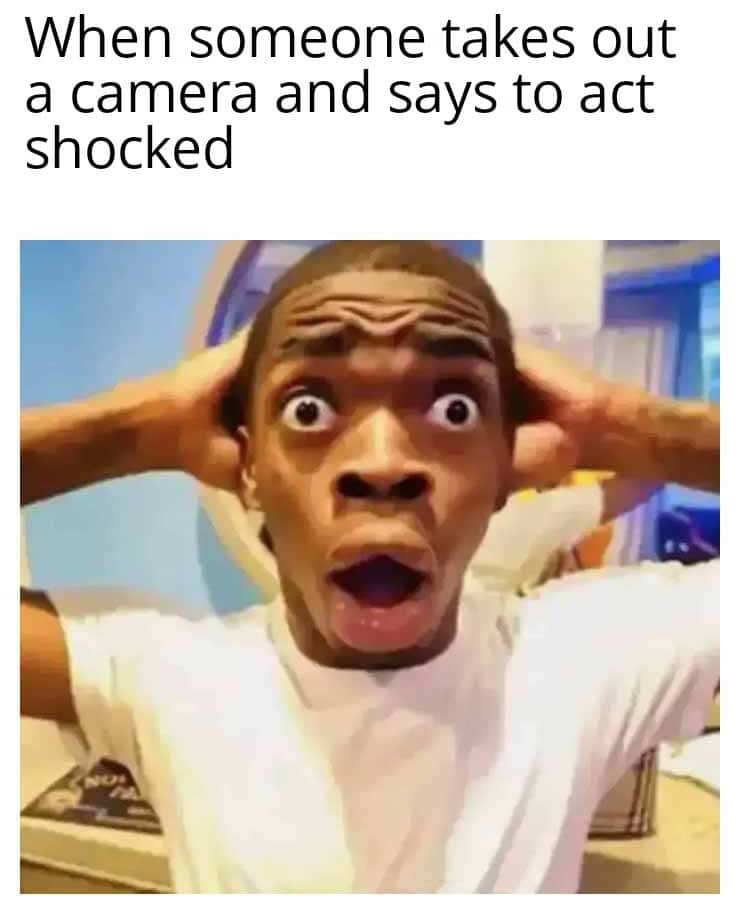 Shocked black guy meme acting shocked for camera