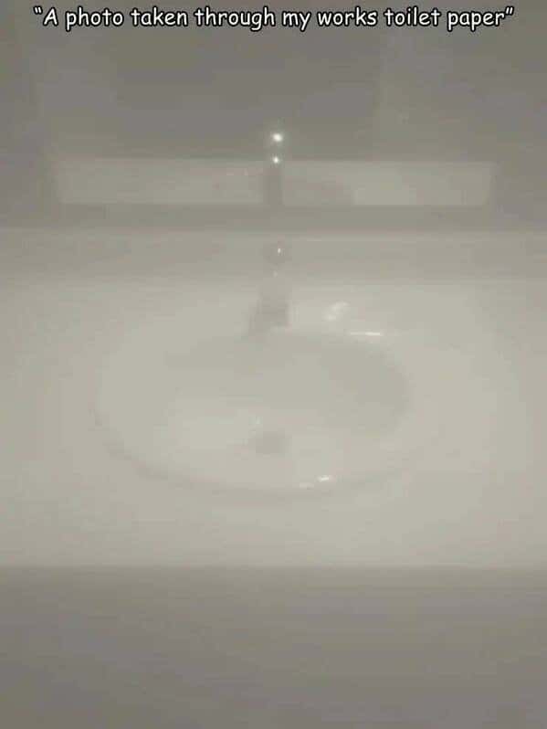 Blurry bathroom sink meme taken through work toilet paper