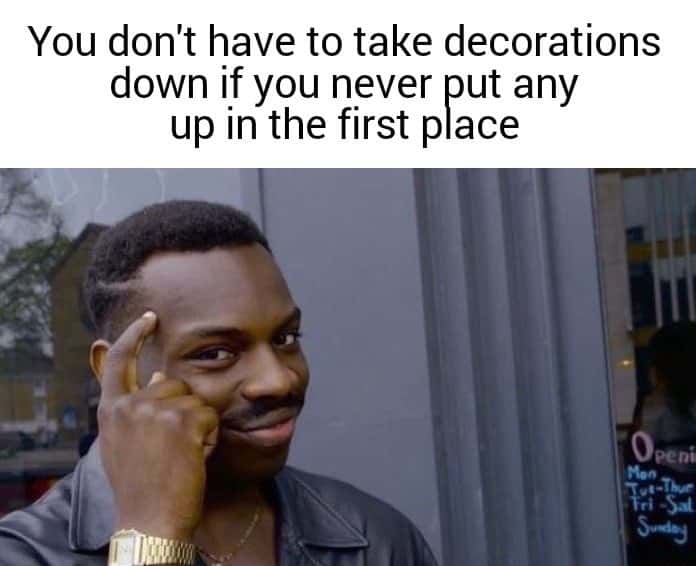 Thinking black guy meme avoids taking down decorations