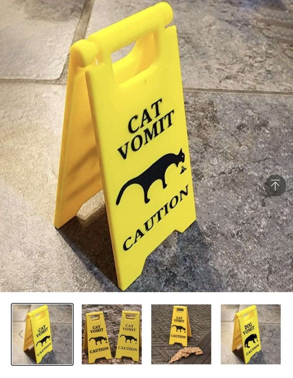 Cat vomit sign meme near real vomit